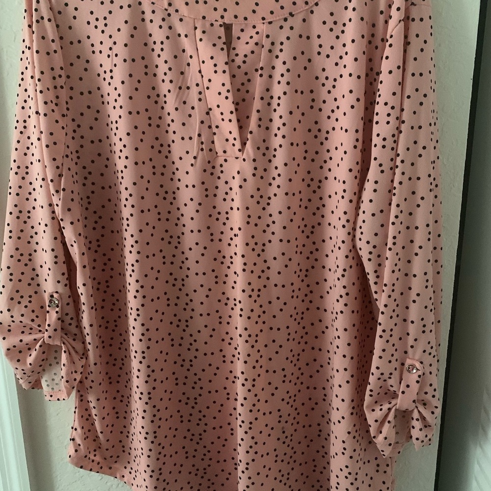 Women’s pink polka dot over the head blouse. Size 1X opening in front V shaped